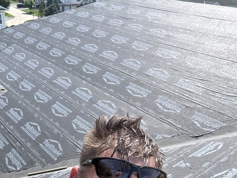 Synthetic underlayment installed on a large roof