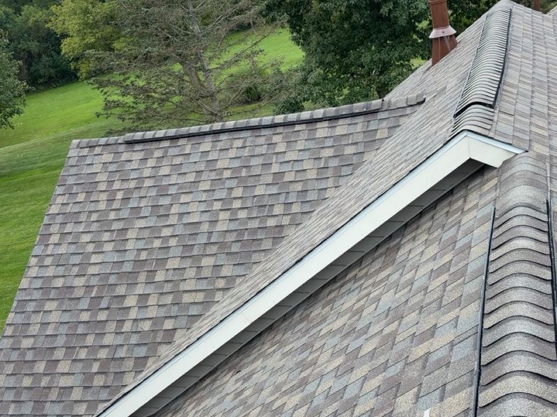 Completed shingle roof with ridge cap